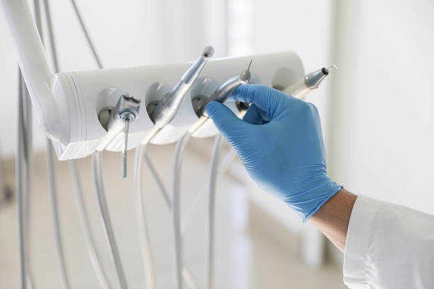 Professional Tooth Extraction technician working in Rawls Springs, MS